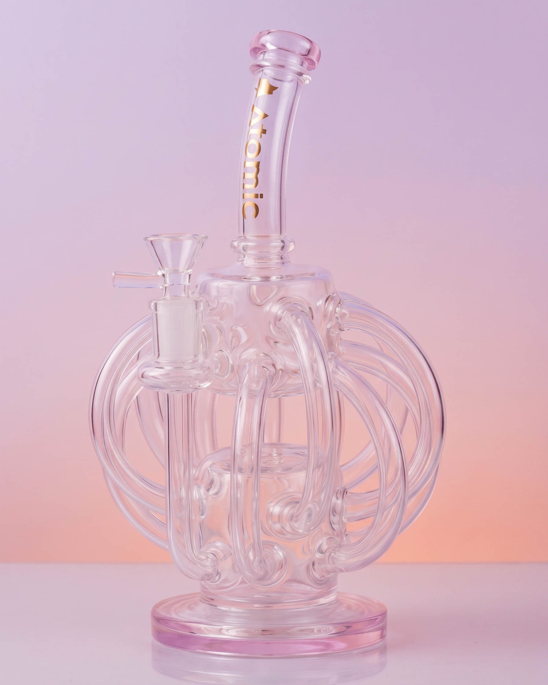 Clear 10-inch Atomic Glass recycler bong with looping octopus-inspired glass arms, curved neck, round base, and removable 14mm glass bowl.