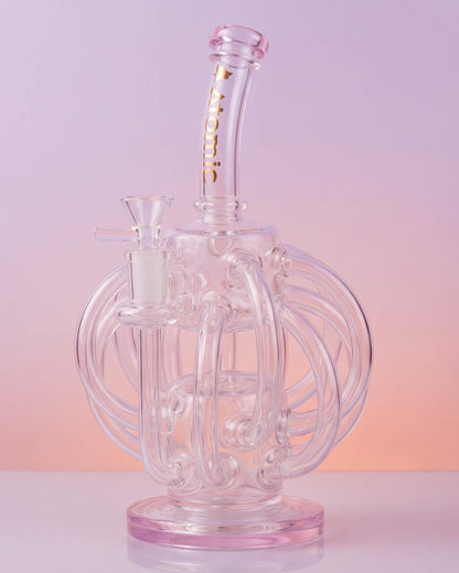 Clear 10-inch Atomic Glass recycler bong with looping octopus-inspired glass arms, curved neck, round base, and removable 14mm glass bowl.