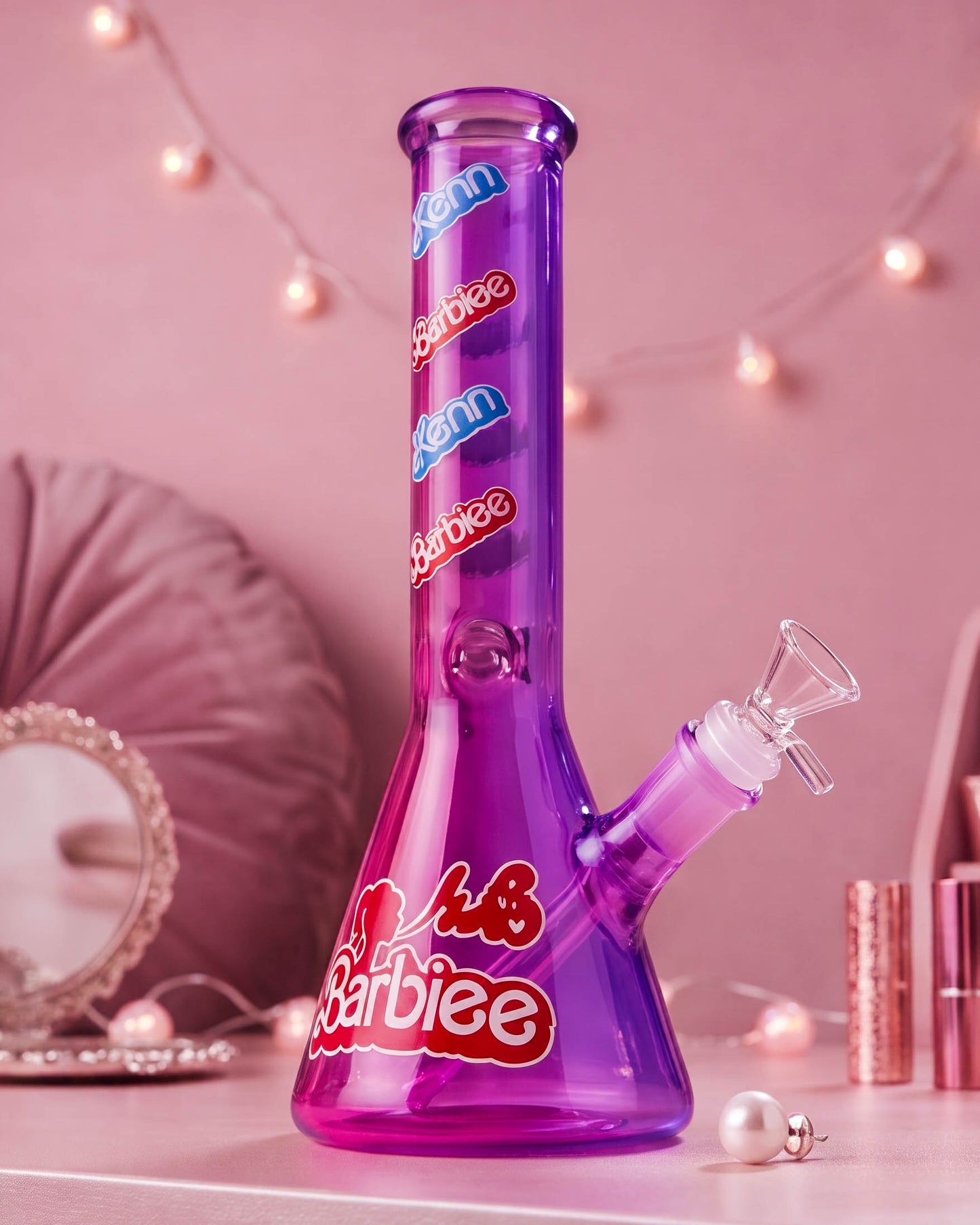 Purple 10-inch beaker bong with colorful fashion-doll-inspired graphics, wide glass base, angled downstem, and clear 14mm bowl.
