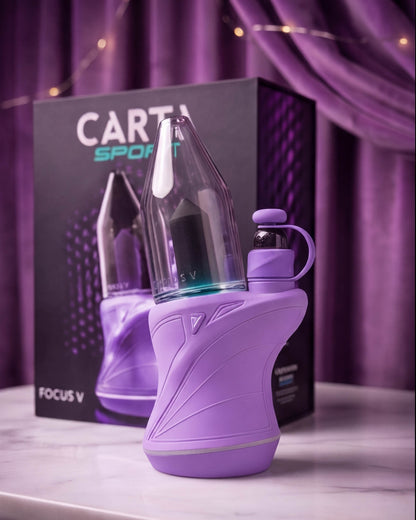 Lilac Focus V CARTA SPORT smart electric dab rig with a smoked glass top, silicone grip, glowing control button, and compact portable design.