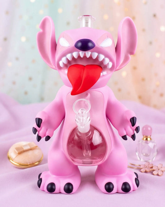Pink 12-inch kawaii monster bong with oversized ears, red tongue, white fangs, black claws, clear belly water chamber, and 14mm glass bowl.