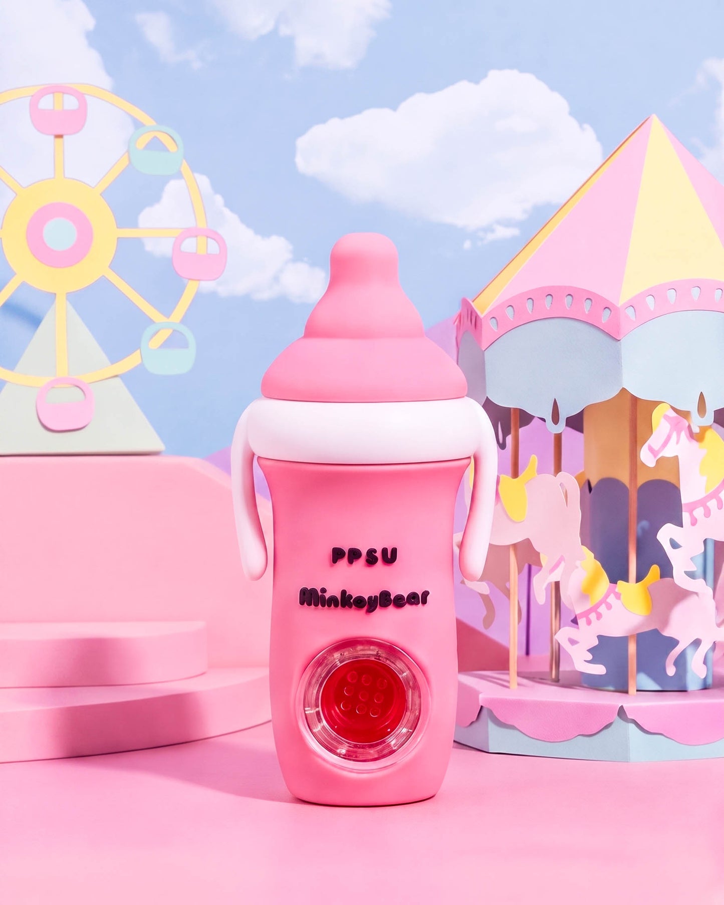 Pink milk bottle-shaped silicone hand pipe with white accent band, side handles, rounded cap, and built-in glass bowl.