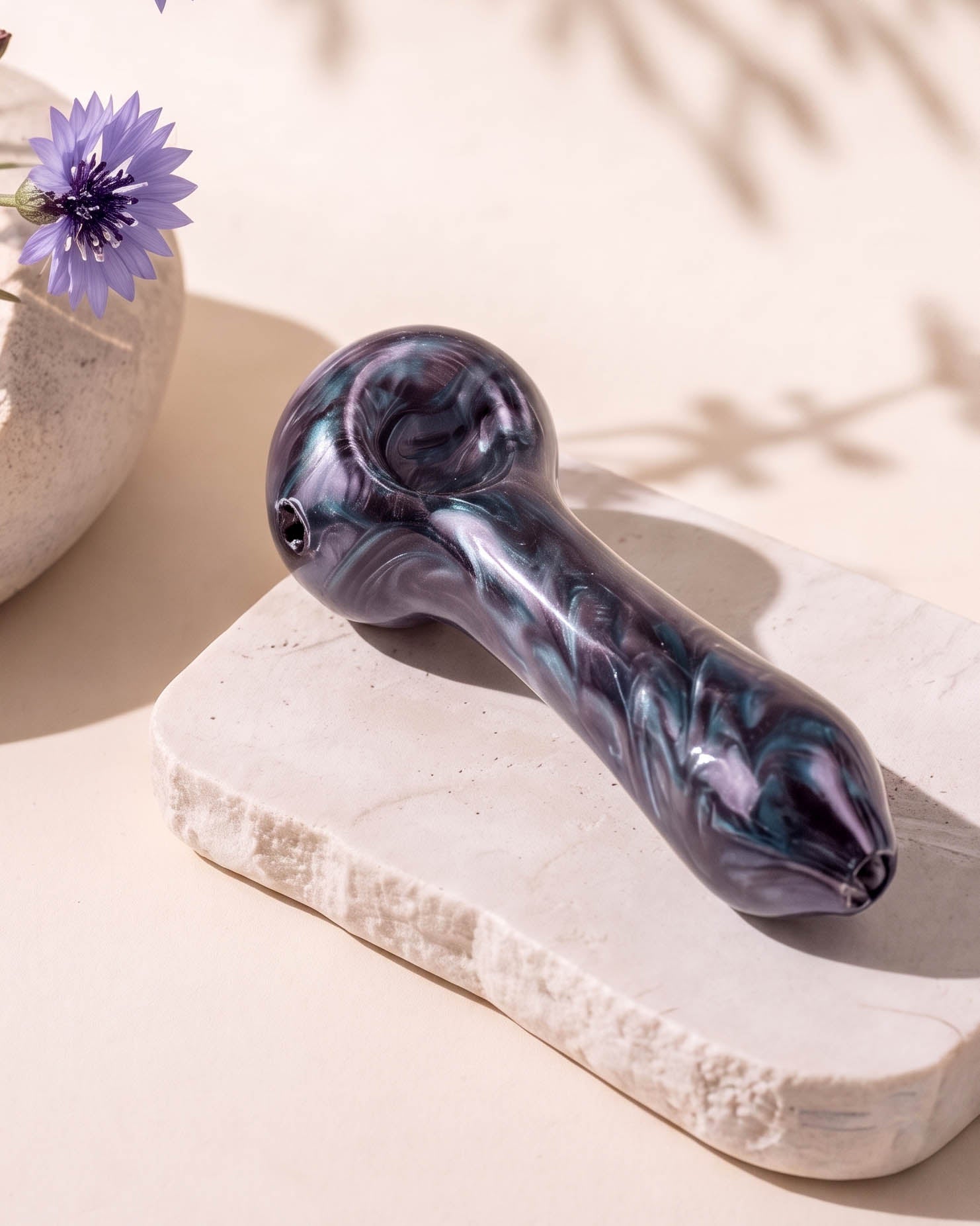 4.5-inch Humboldt Blowers glass hand pipe with swirling purple, blue, and pearlescent nebula-style colors, rounded bowl, and side carb.